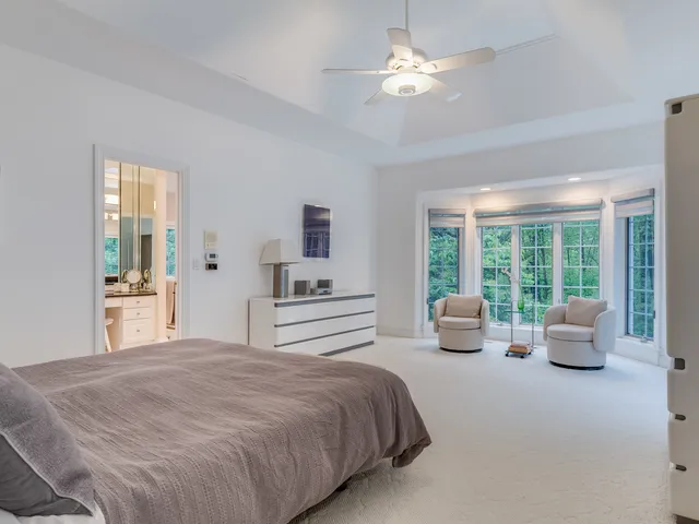 a kitchen with granite countertop a sink and a refrigerator
