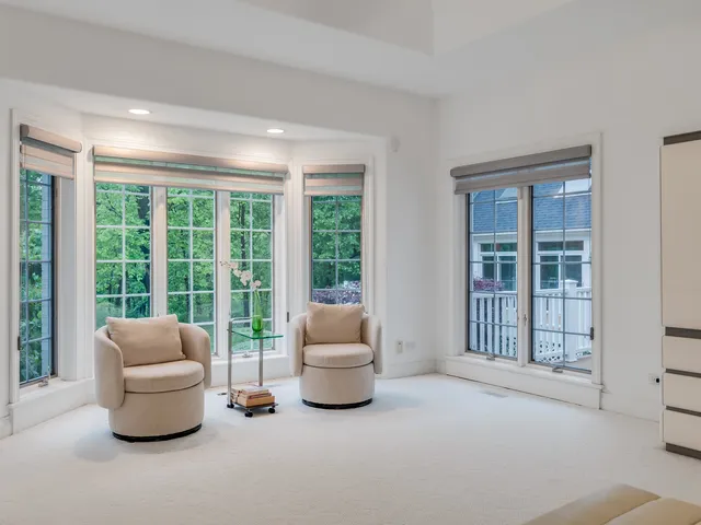 a bathroom with a granite countertop sink a mirror and a shower