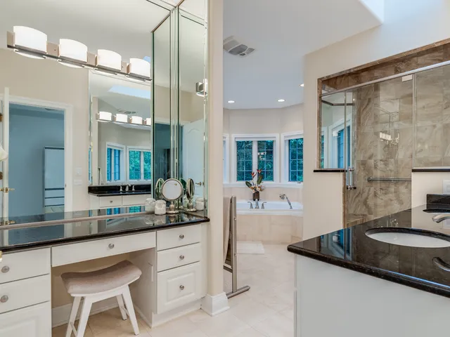 a bathroom with a double vanity sink and mirror