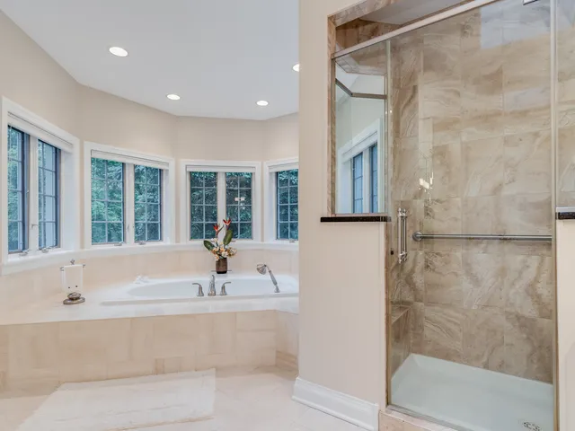 a bedroom with a bed cabinets and window