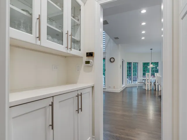 a bathroom with a granite countertop sink a toilet and a mirror