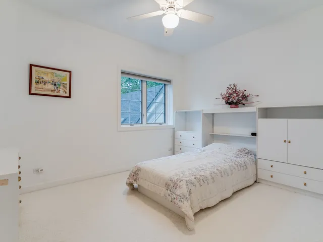 a kitchen with stainless steel appliances a sink counter space cabinets and a window