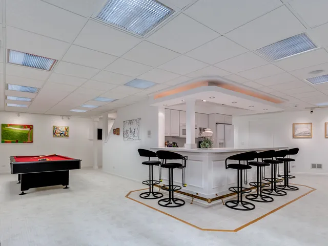 a view of a lobby with furniture and floor to ceiling window