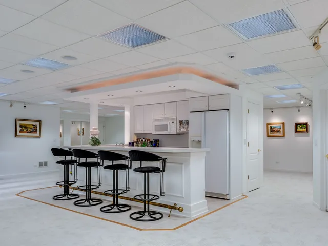 a swimming pool with outdoor seating and yard