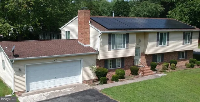 a aerial view of a house with a garden and plants