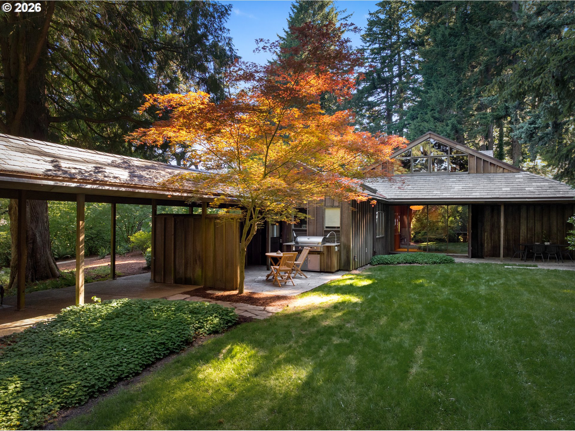 4645 Southwest Fairview Boulevard Portland, OR 97221 - Photo 30 of 38 a view of a backyard with a patio and a garden