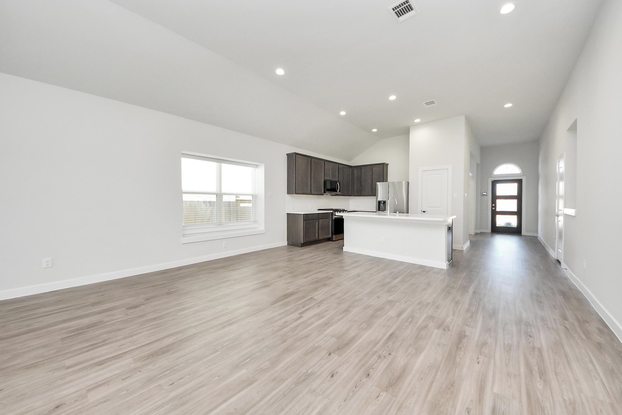 21507 Indigo Ruth Drive Spring, TX 77379 - Photo 12 of 33 a view of a kitchen with furniture and wooden floor