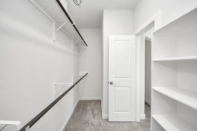 a view of a backyard with wooden fence