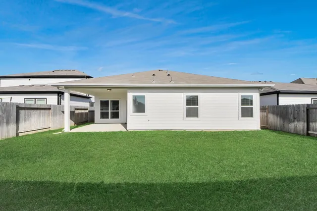 a backyard of a house with lots of green space