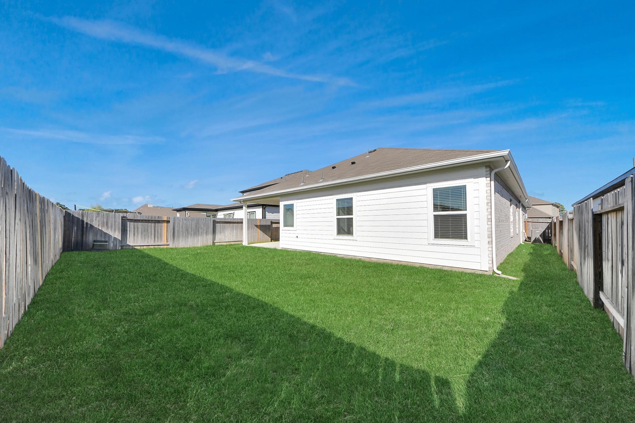 21507 Indigo Ruth Drive Spring, TX 77379 - Photo 28 of 33 a backyard of a house with lots of green space