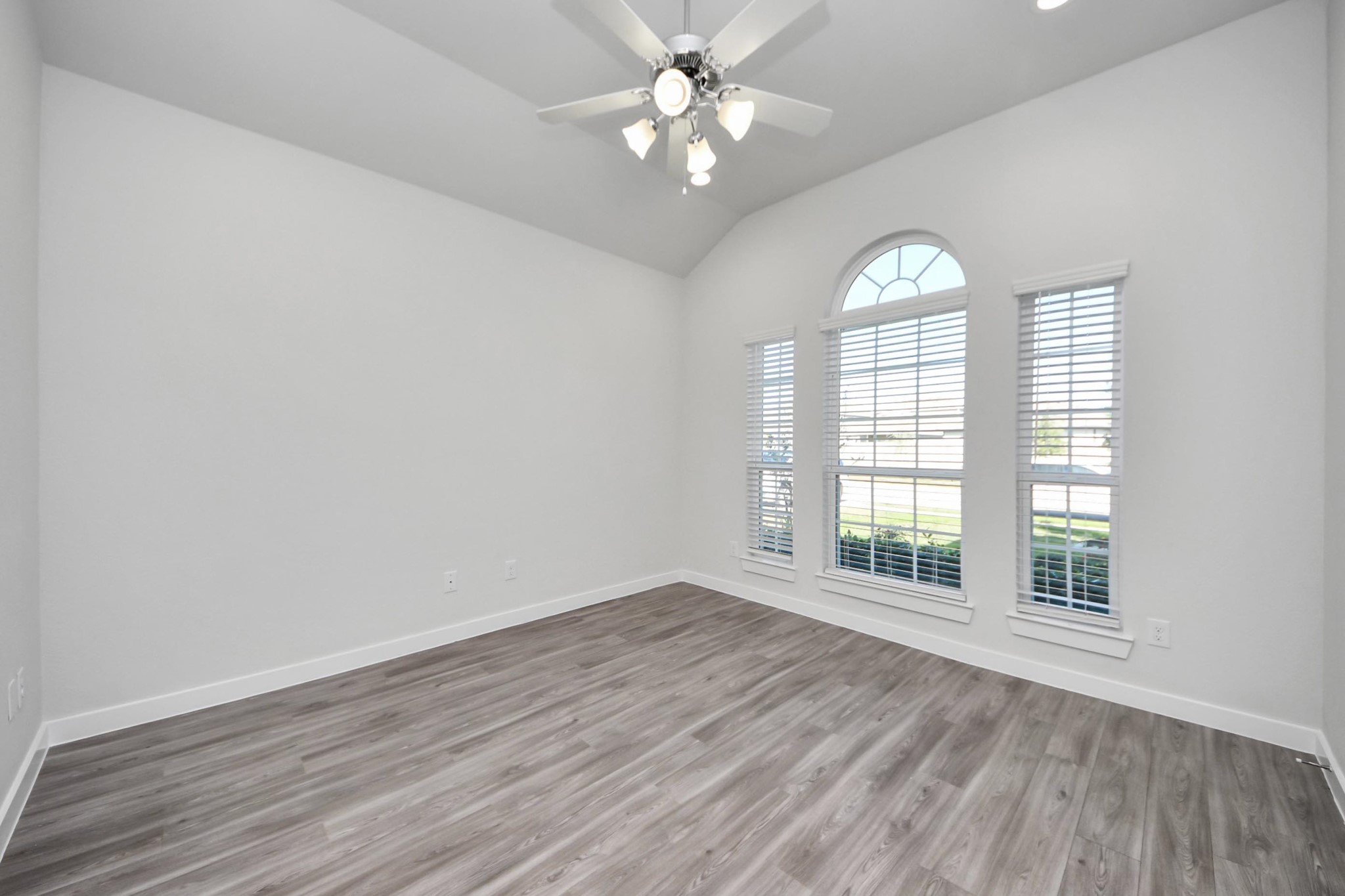 21507 Indigo Ruth Drive Spring, TX 77379 - Photo 3 of 33 an empty room with wooden floor and windows