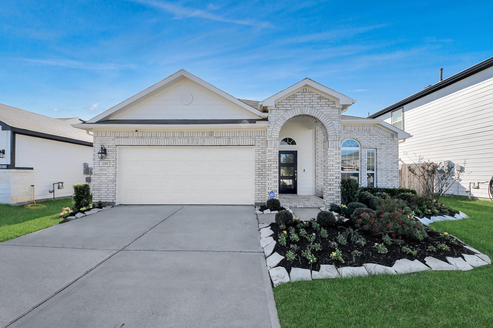21507 Indigo Ruth Drive Spring, TX 77379 - Photo 31 of 33 a view of a house with a small yard and plants