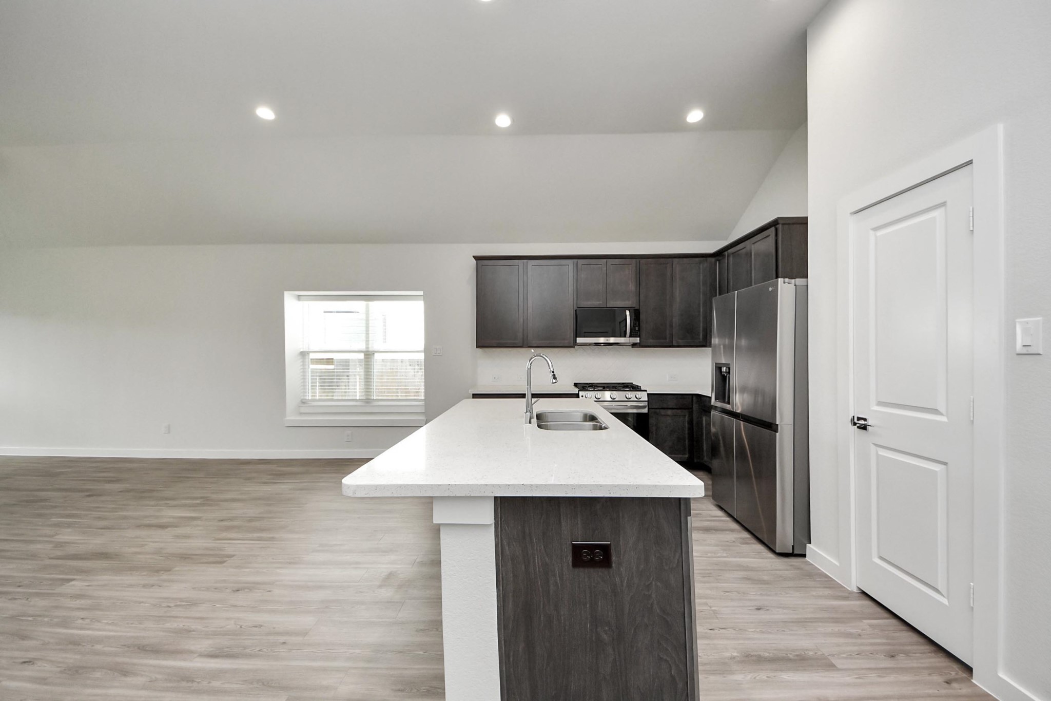 21507 Indigo Ruth Drive Spring, TX 77379 - Photo 5 of 33 a kitchen with a sink and a refrigerator