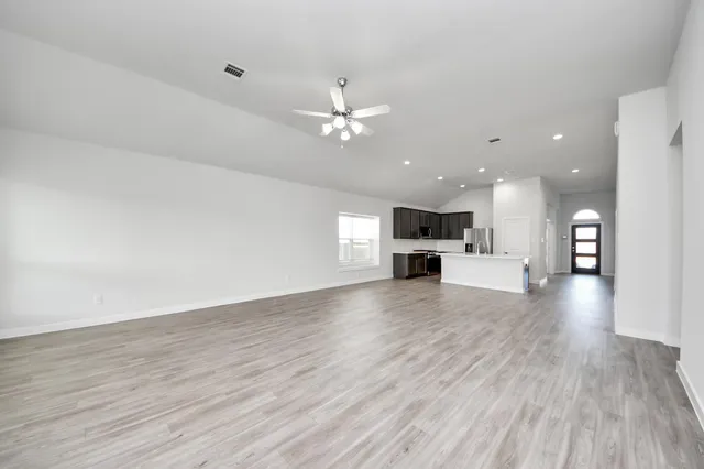 a view of kitchen with furniture and wooden floor