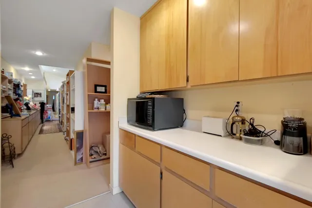a kitchen with a sink and cabinets