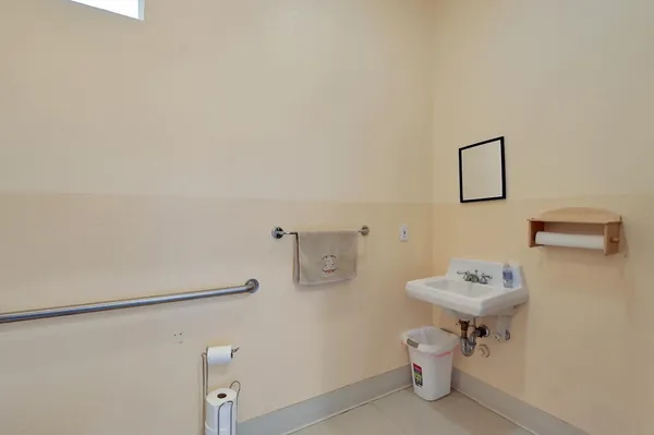a bathroom with a sink toilet and vanity