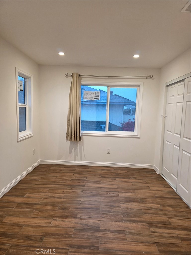 508 Sharon Road Arcadia, CA 91007 - Photo 3 of 10 a view of an empty room with wooden floor and a window