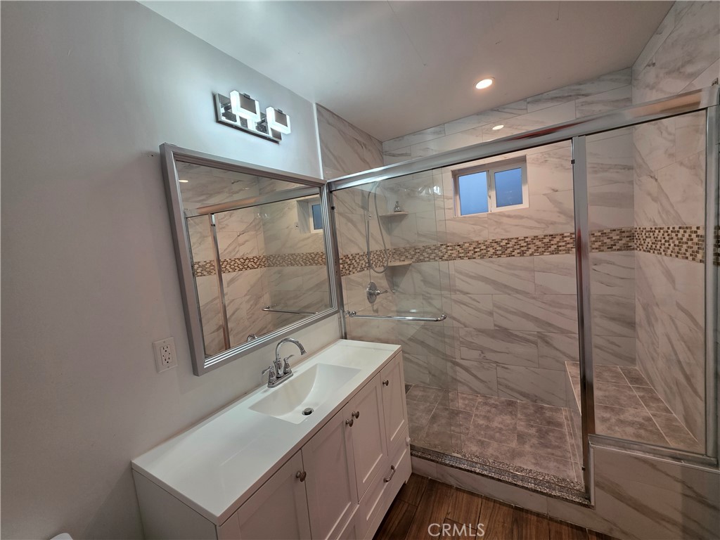 508 Sharon Road Arcadia, CA 91007 - Photo 7 of 10 a bathroom with a shower sink and mirror