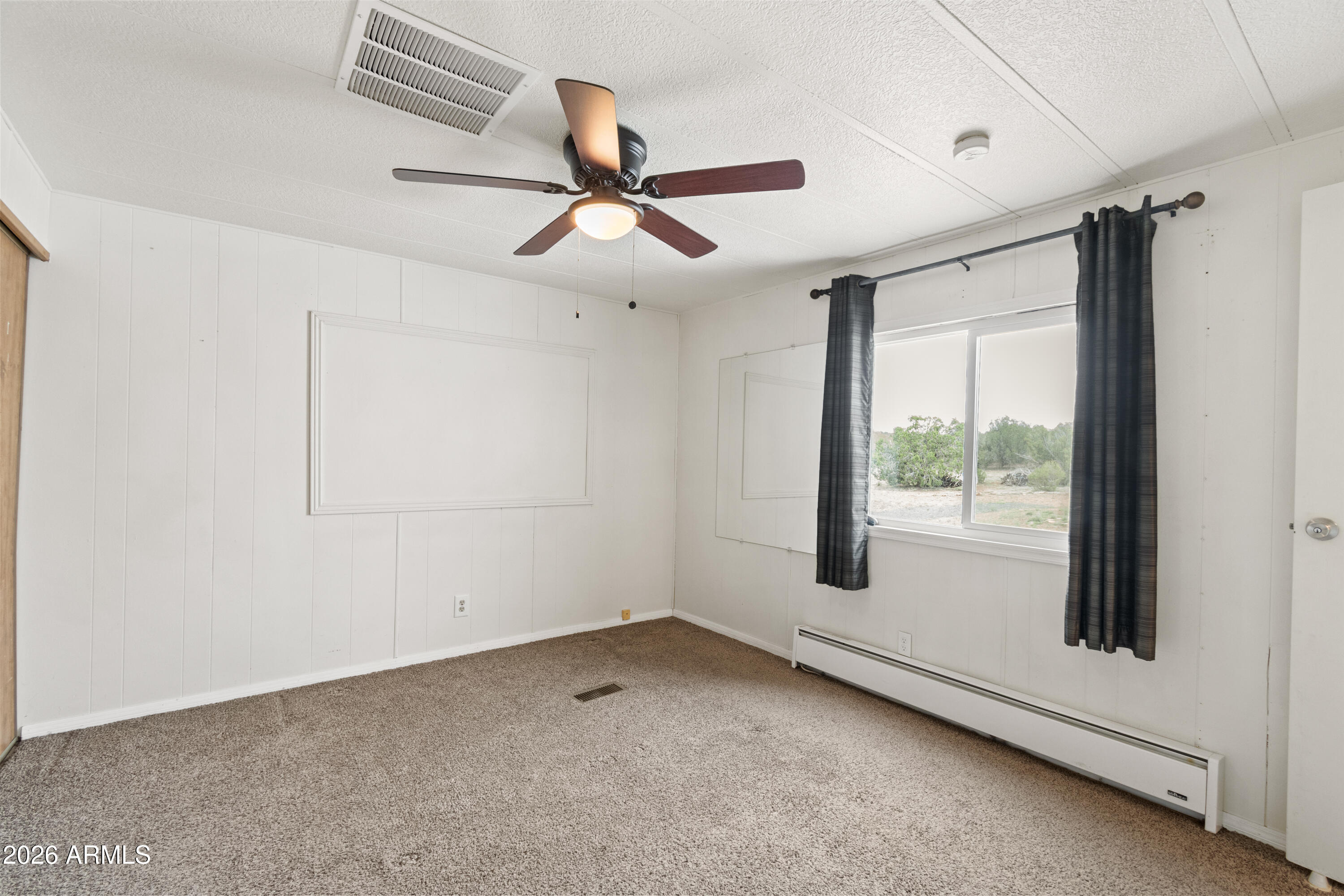 2385 County Line Circle Ash Fork, AZ 86320 - Photo 12 of 35 a view of an empty room with a window