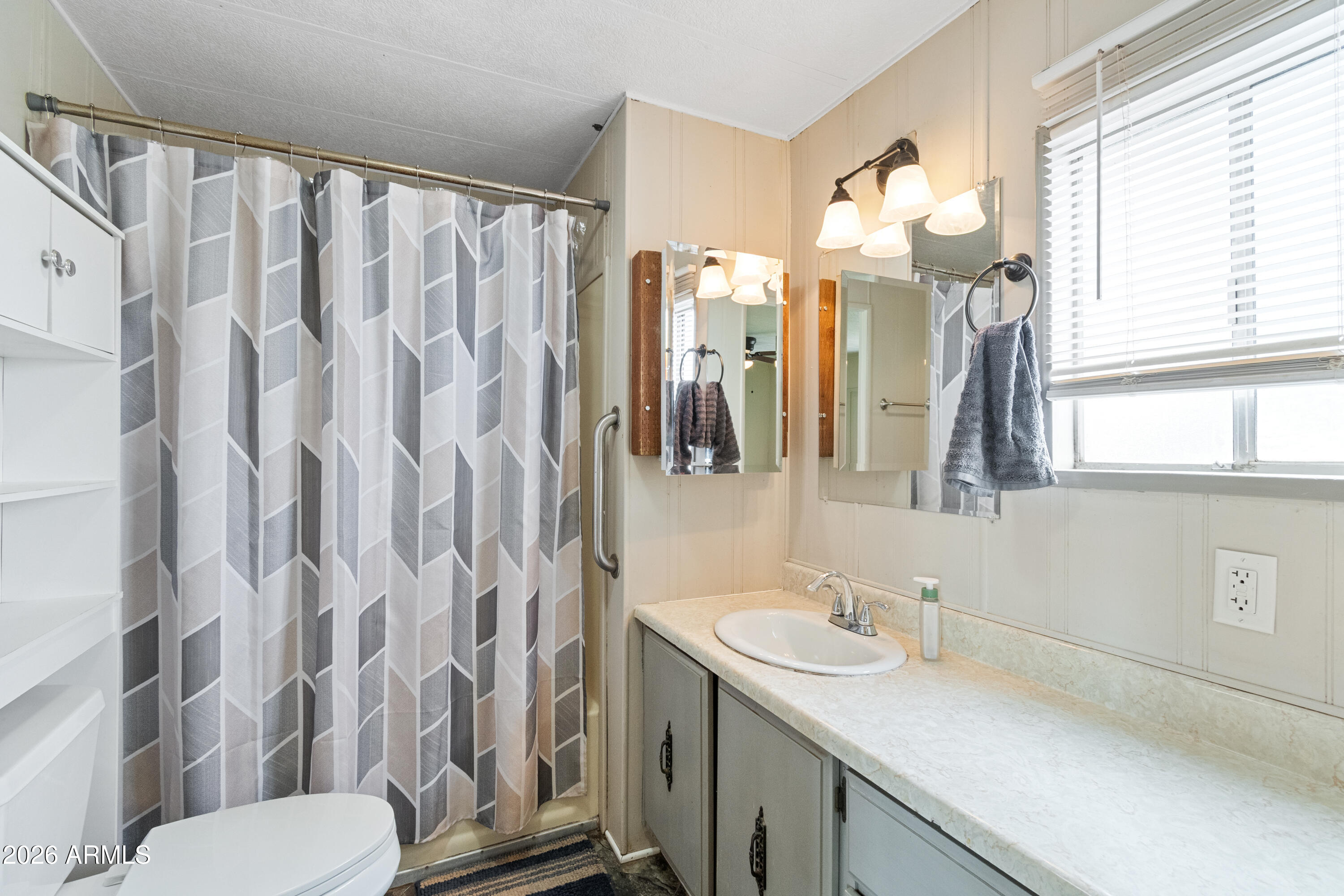 2385 County Line Circle Ash Fork, AZ 86320 - Photo 15 of 35 a bathroom with a granite countertop sink toilet and shower
