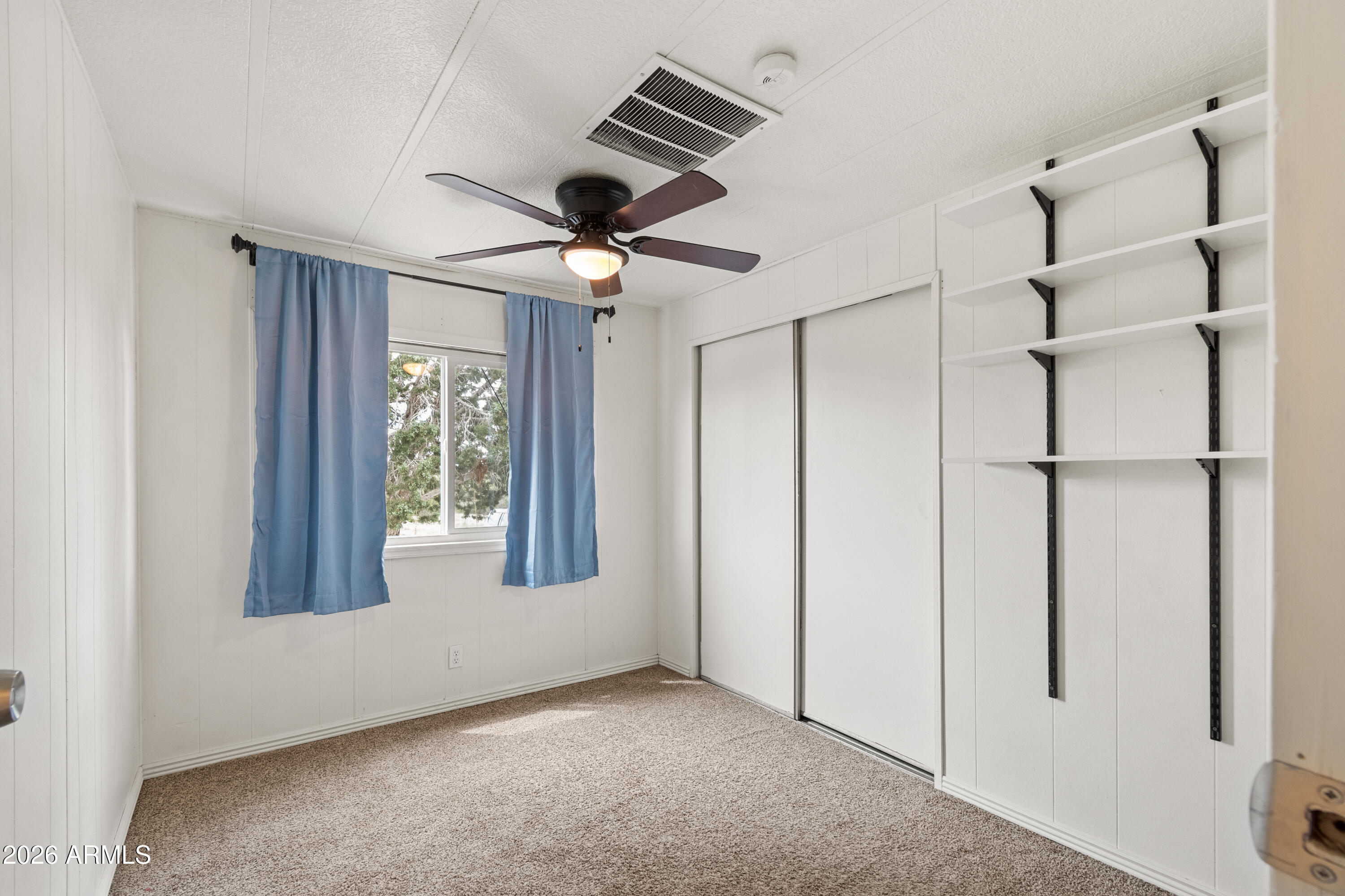2385 County Line Circle Ash Fork, AZ 86320 - Photo 17 of 35 a view of an empty room with a window