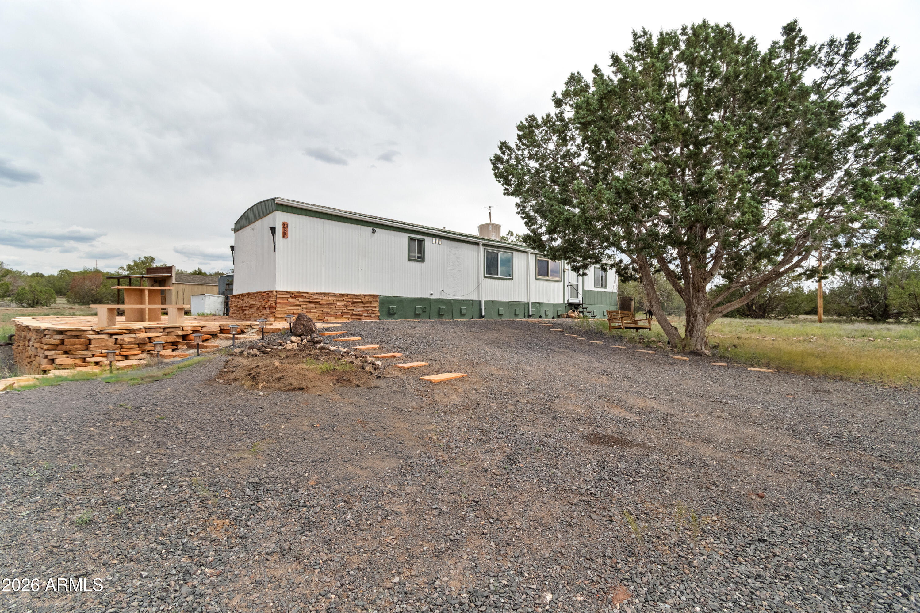 2385 County Line Circle Ash Fork, AZ 86320 - Photo 22 of 35 a view of a house with a yard