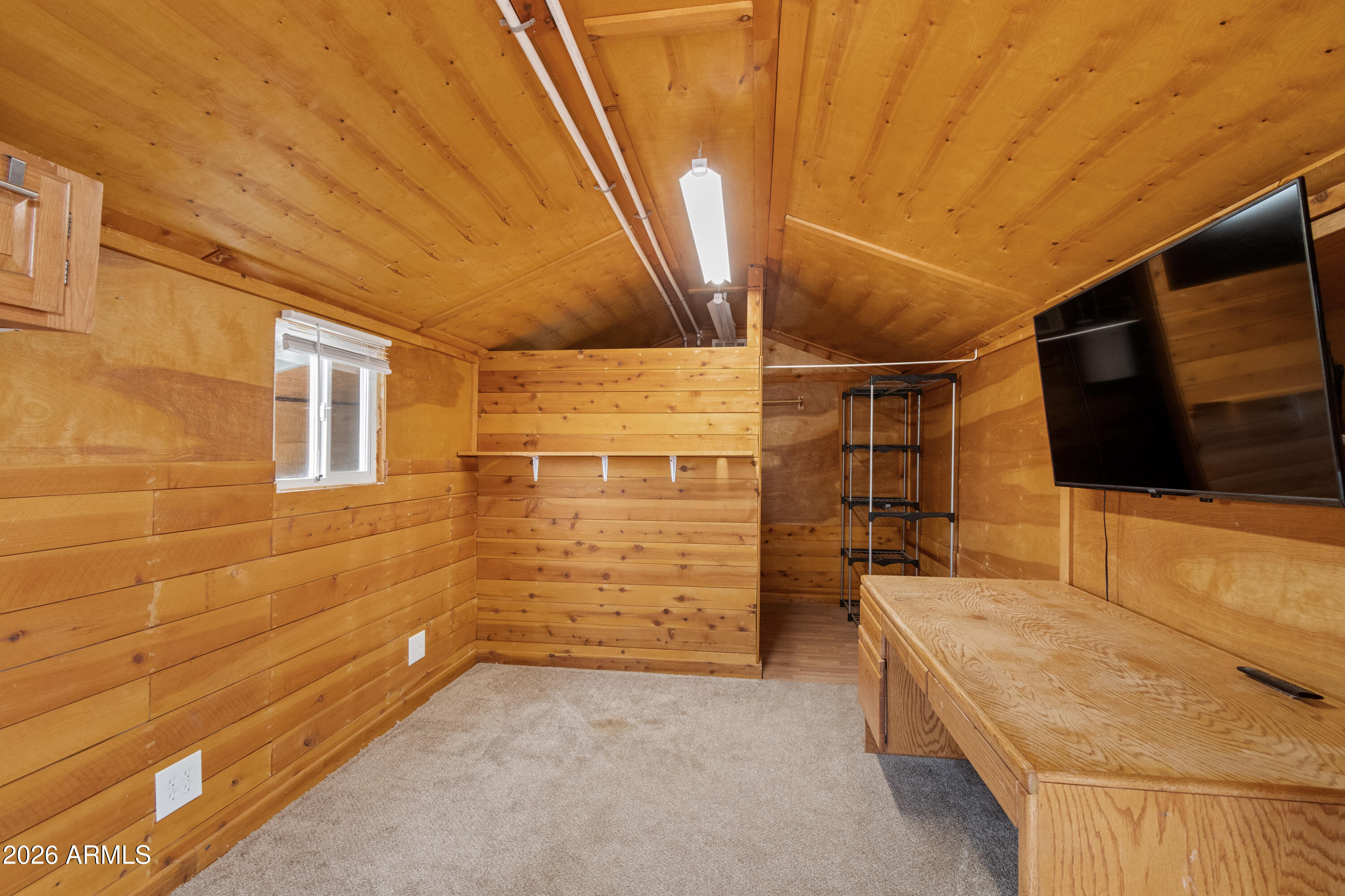 2385 County Line Circle Ash Fork, AZ 86320 - Photo 25 of 35 a bedroom with a bed and a flat screen tv