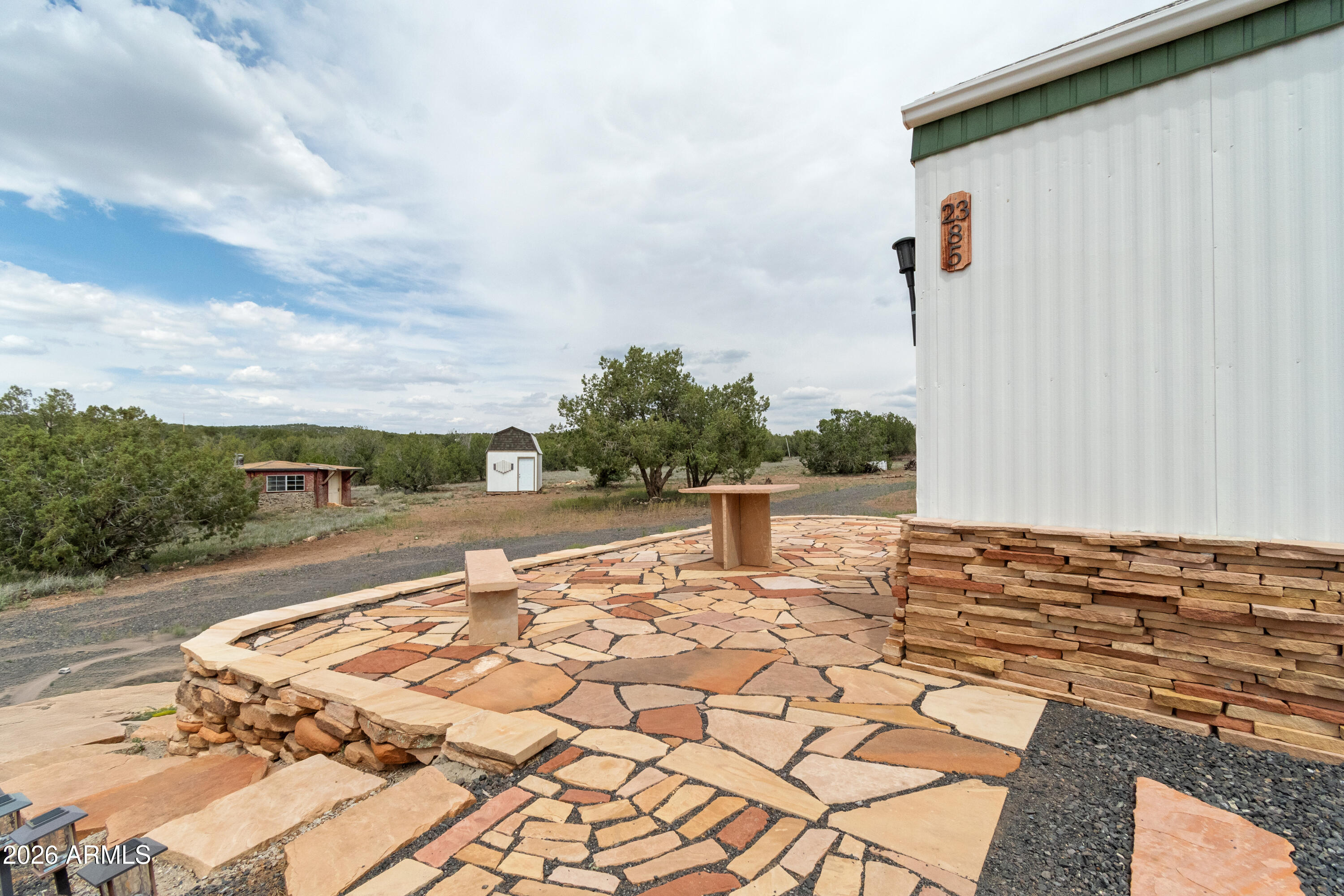 2385 County Line Circle Ash Fork, AZ 86320 - Photo 3 of 35 a view of a backyard with sitting area