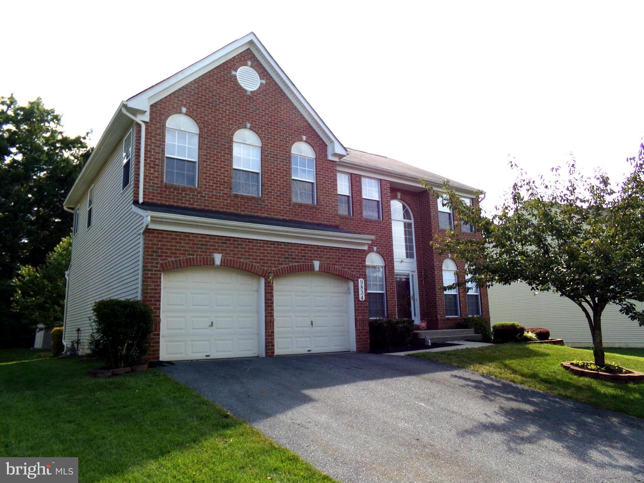 9834 Farm Pond Road Laurel, MD 20708 - Photo 1 of 30 a front view of a house with a yard