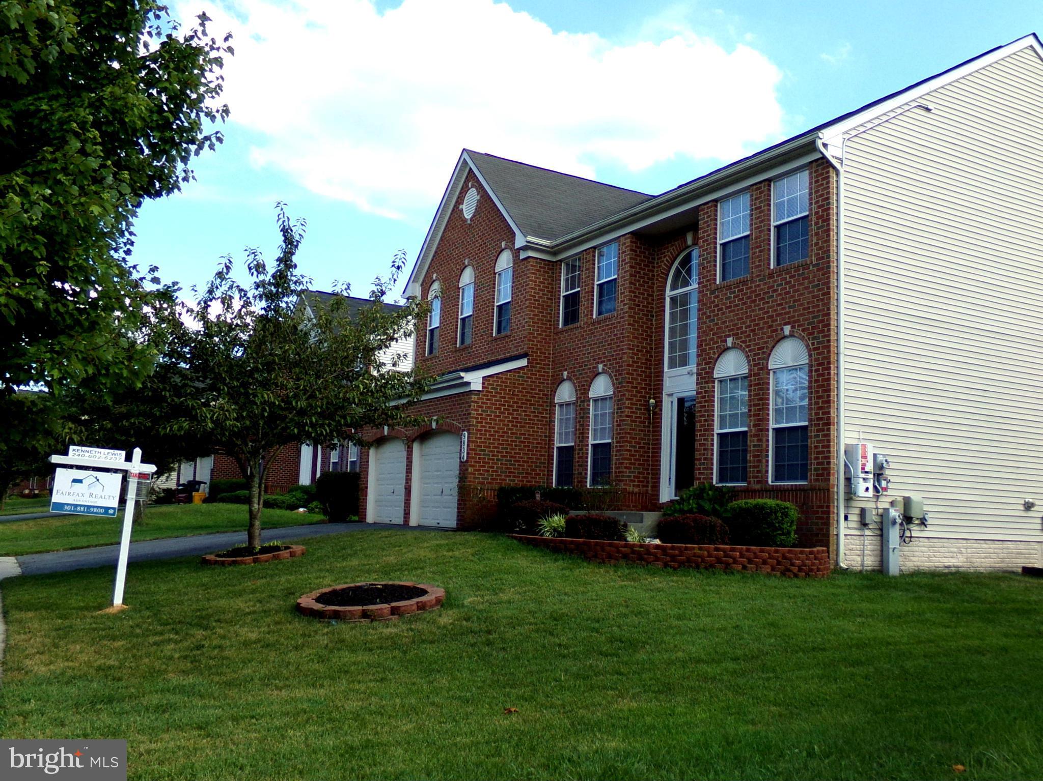 9834 Farm Pond Road Laurel, MD 20708 - Photo 2 of 30 a front view of a house with a garden