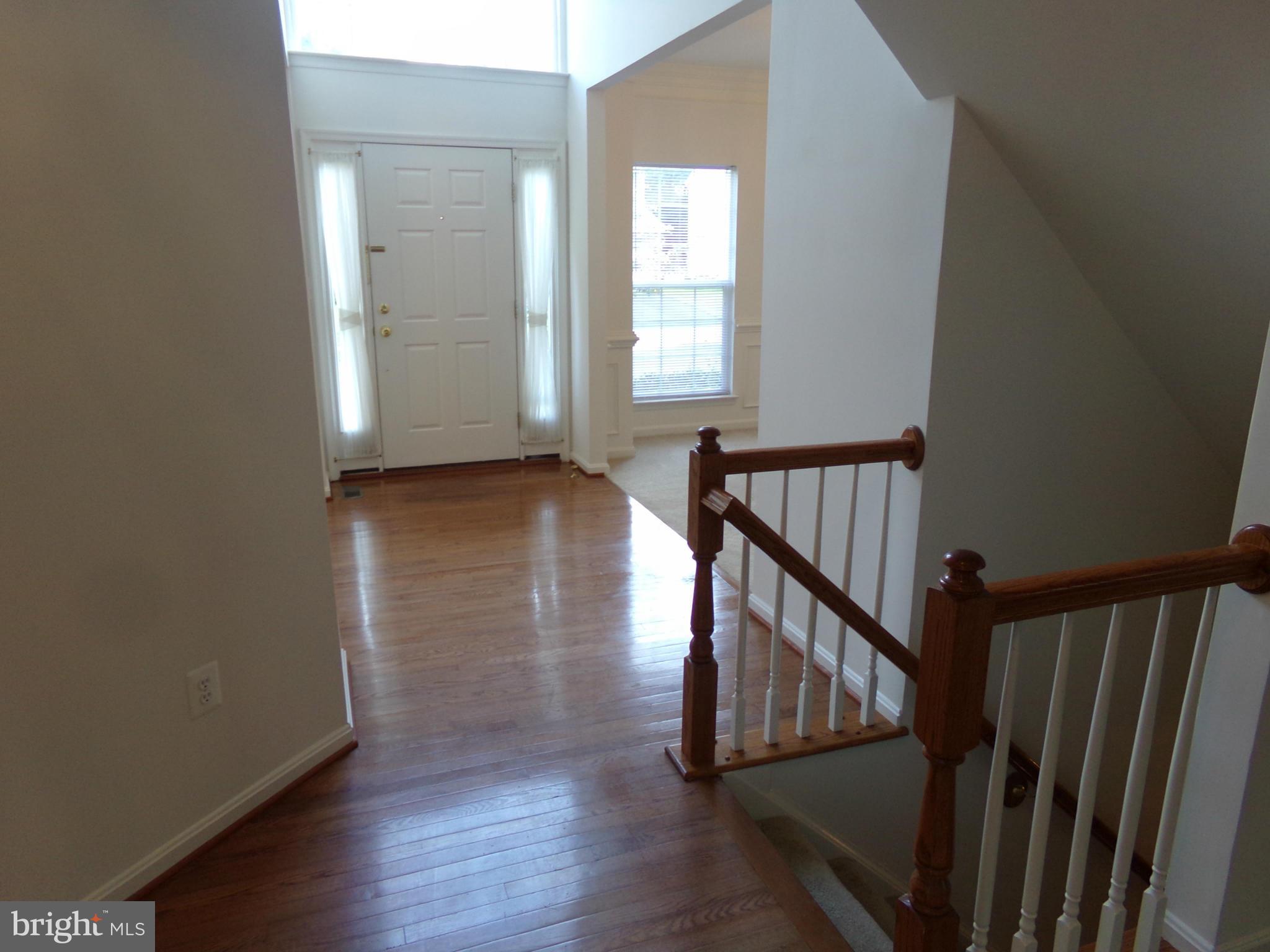 9834 Farm Pond Road Laurel, MD 20708 - Photo 11 of 30 a view of entryway with wooden floor