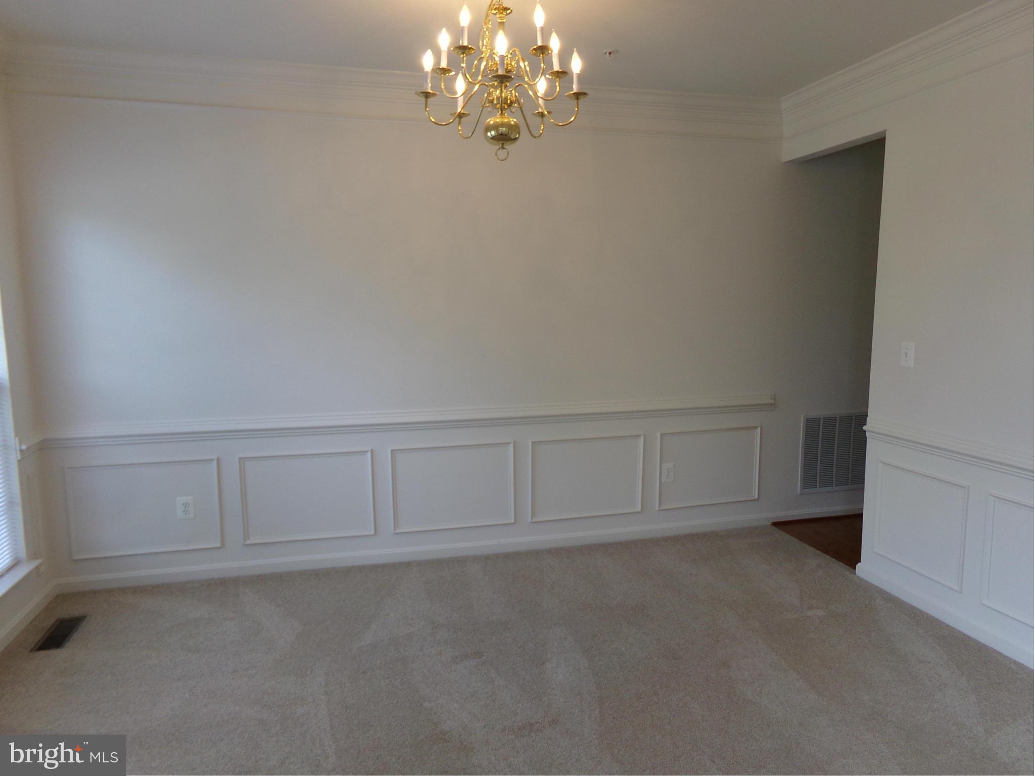 9834 Farm Pond Road Laurel, MD 20708 - Photo 16 of 30 a view of an empty room with chandelier