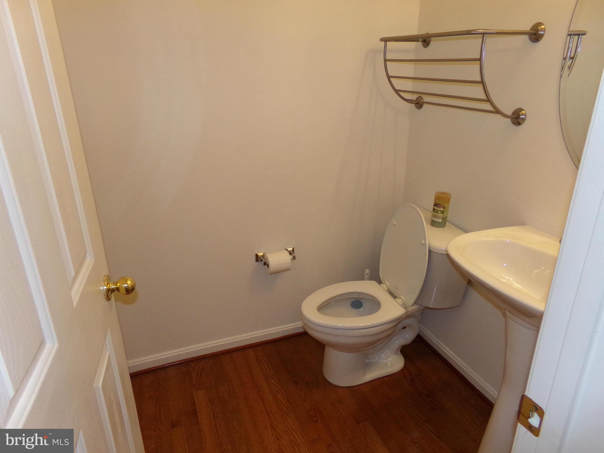 9834 Farm Pond Road Laurel, MD 20708 - Photo 19 of 30 a white toilet sitting next to a shower