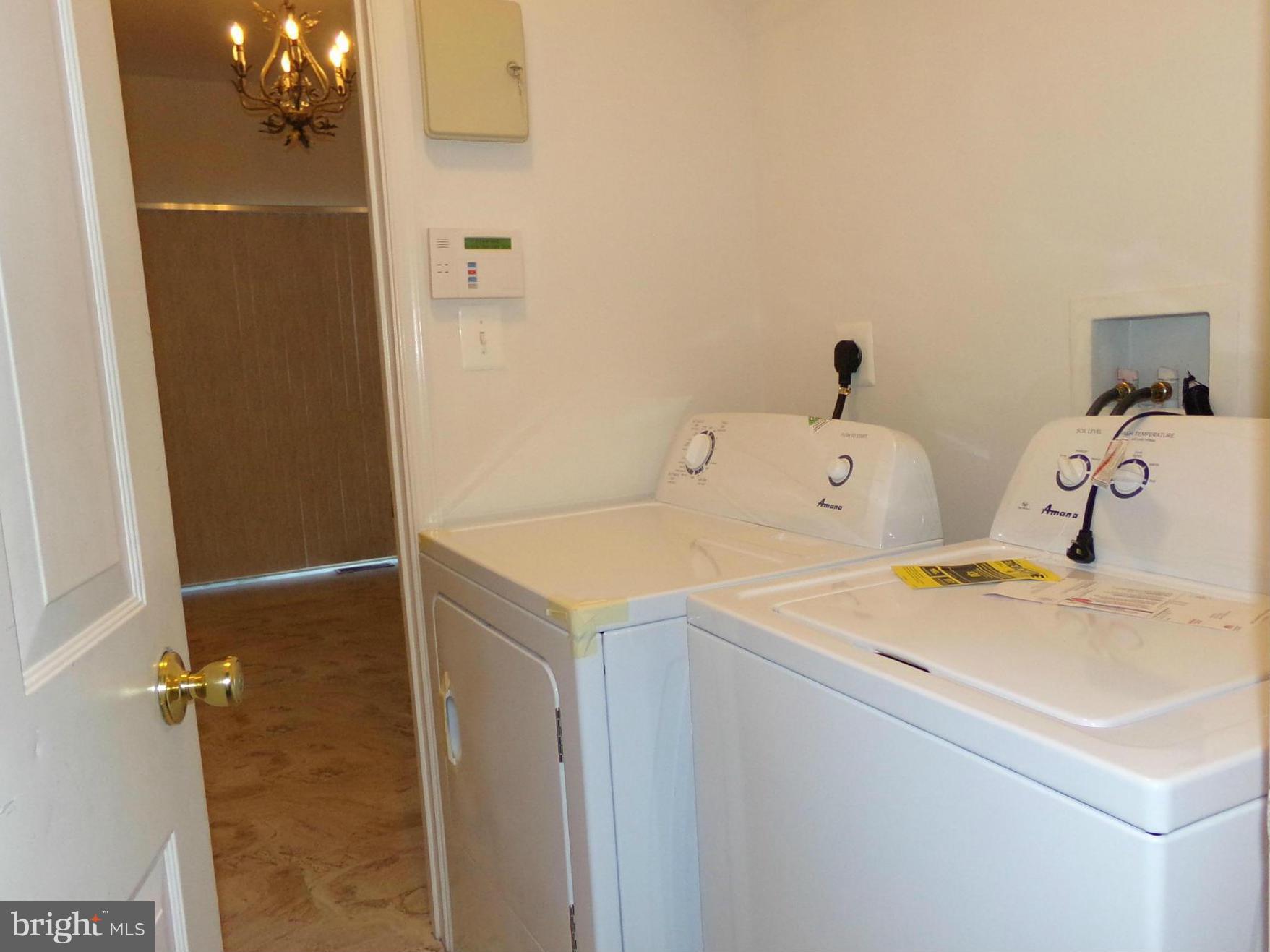 9834 Farm Pond Road Laurel, MD 20708 - Photo 20 of 30 a utility room with dryer and washer
