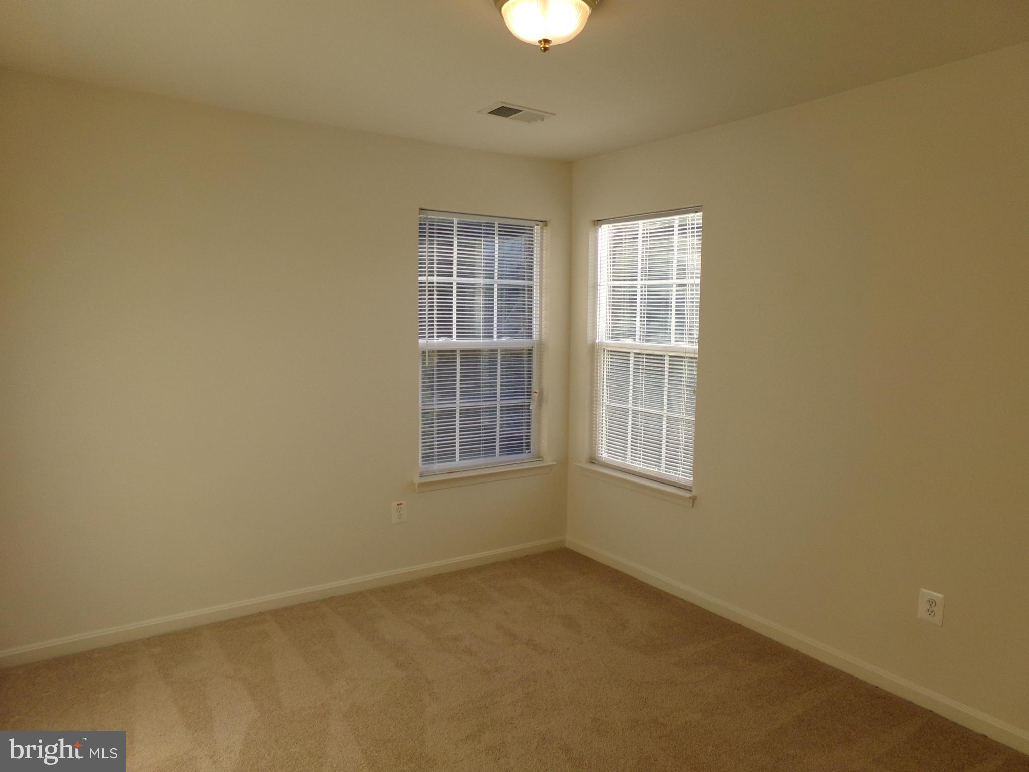 9834 Farm Pond Road Laurel, MD 20708 - Photo 27 of 30 an empty room with a window