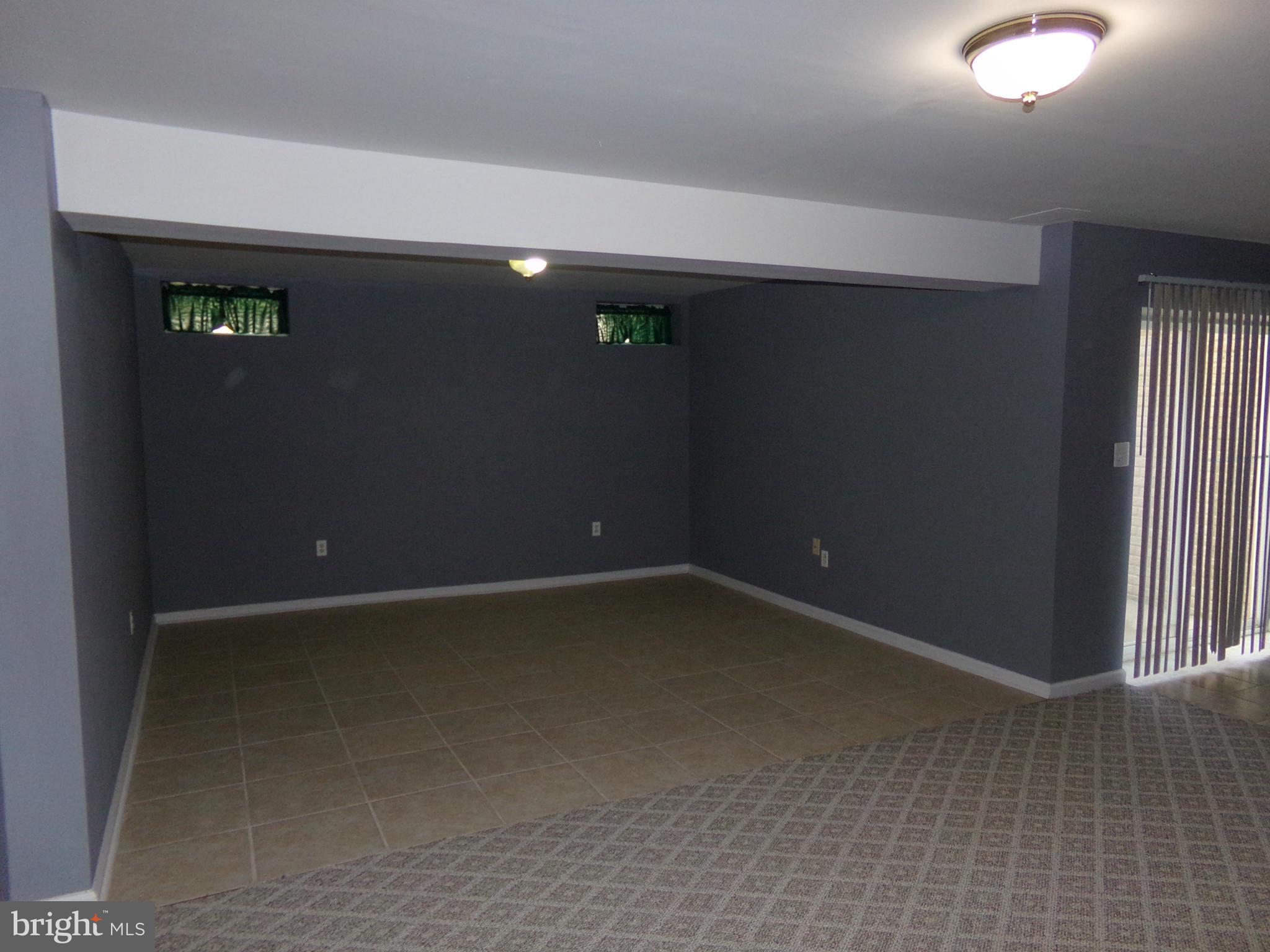 9834 Farm Pond Road Laurel, MD 20708 - Photo 30 of 30 an empty room with windows
