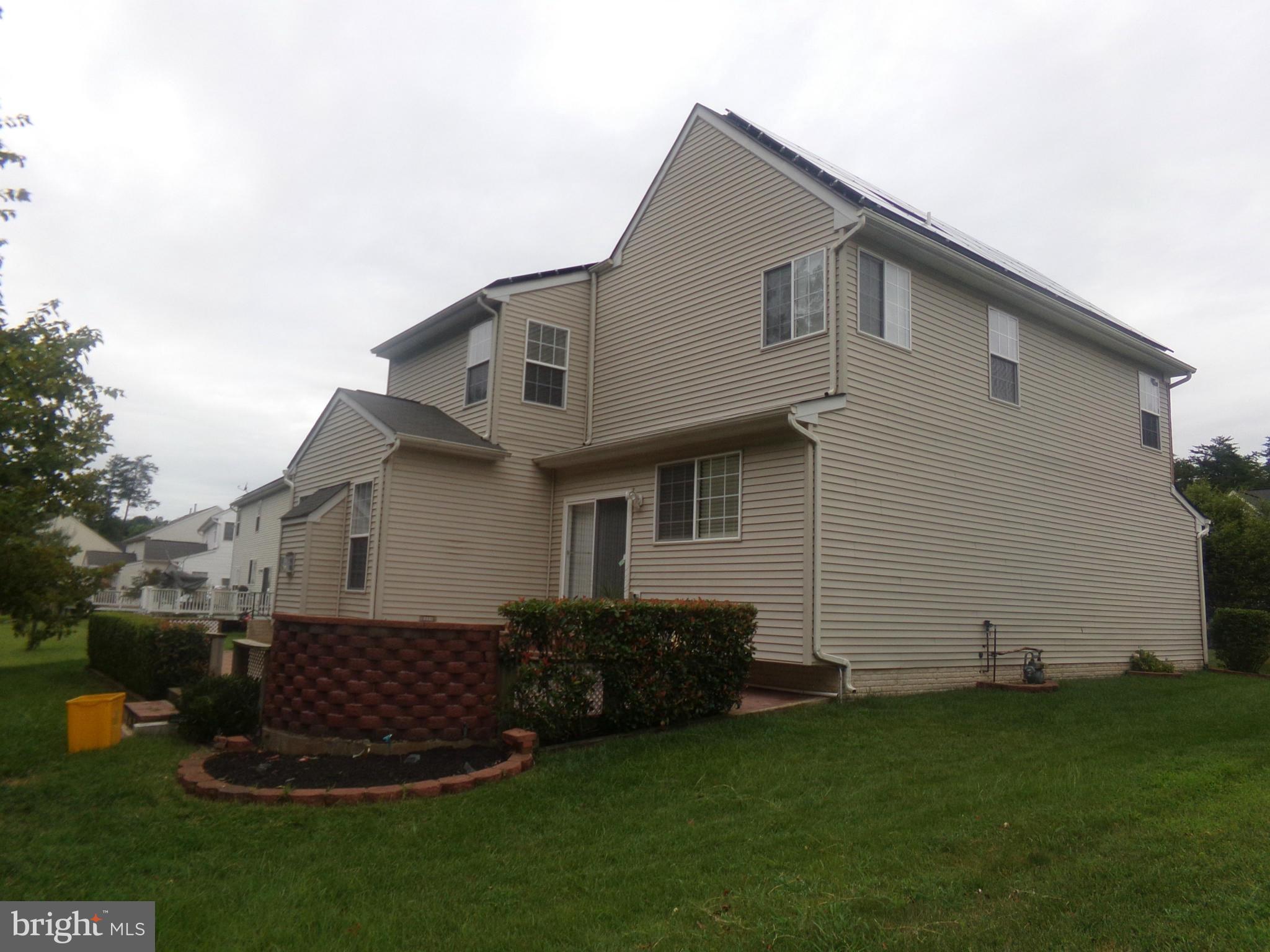 9834 Farm Pond Road Laurel, MD 20708 - Photo 5 of 30 a front view of a house with a garden