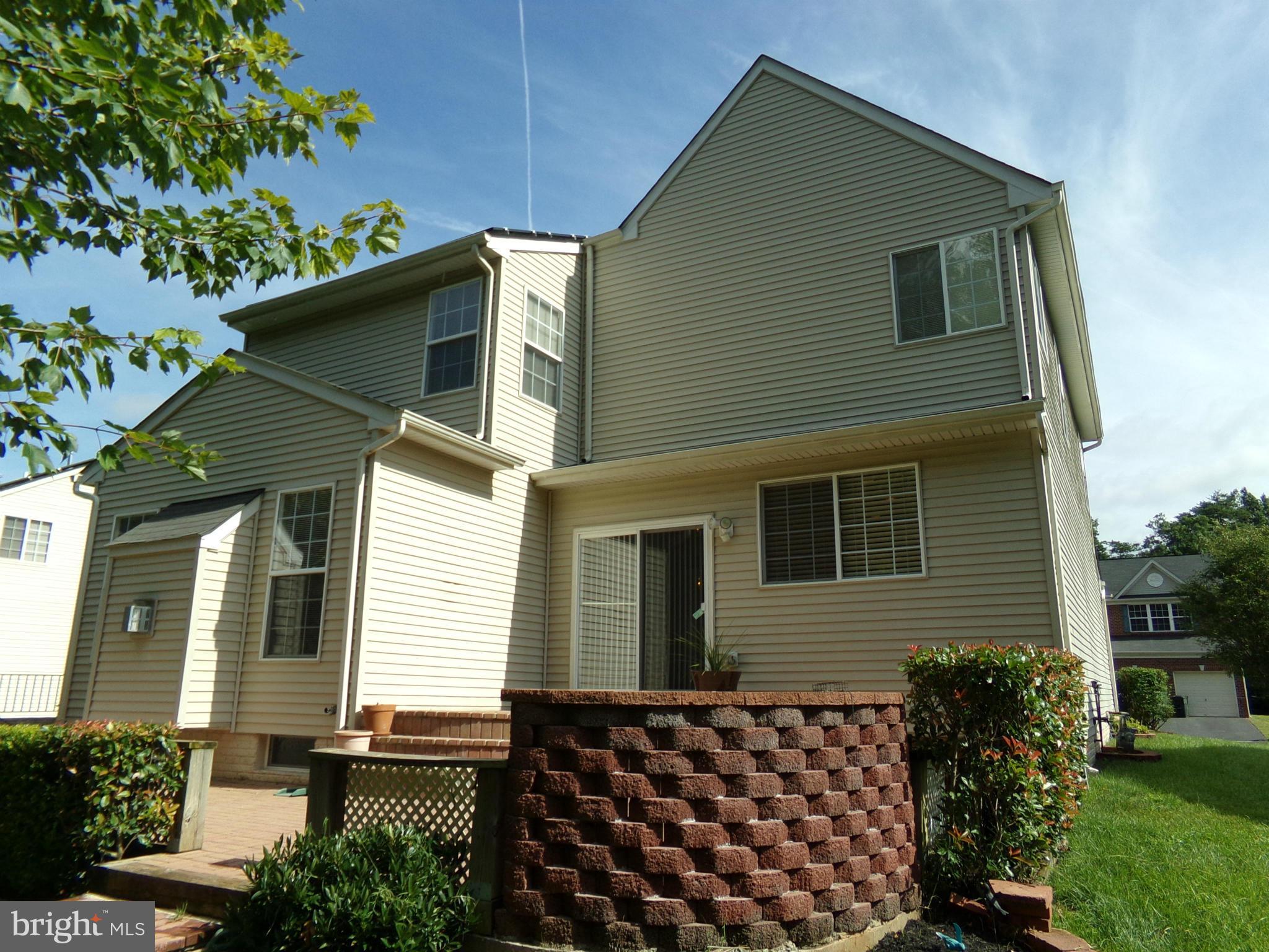9834 Farm Pond Road Laurel, MD 20708 - Photo 6 of 30 a front view of a house with garden