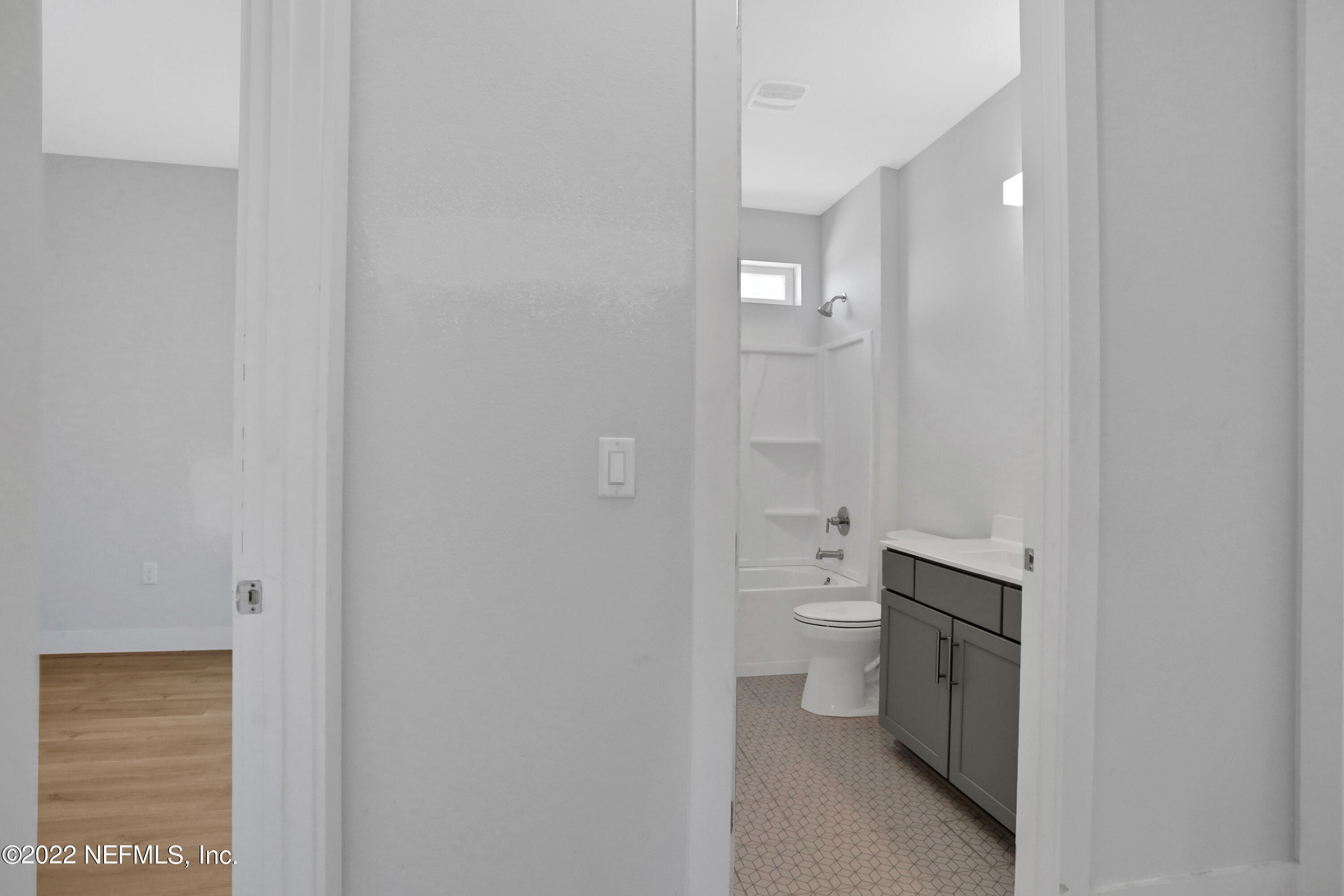 278 Farmfield Drive St. Augustine, FL 32092 - Photo 22 of 36 a bathroom with a granite countertop toilet and a sink
