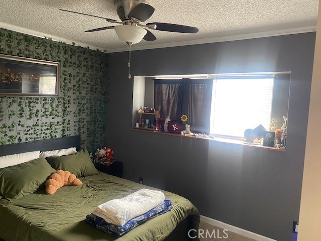 1665 North Fillmore Avenue Rialto, CA 92376 - Photo 12 of 23 a bedroom with a bed and a window