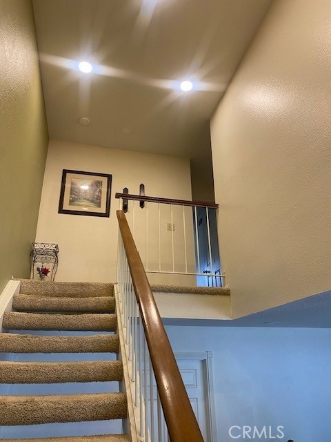 1665 North Fillmore Avenue Rialto, CA 92376 - Photo 7 of 23 a view of staircase with white walls and stairs