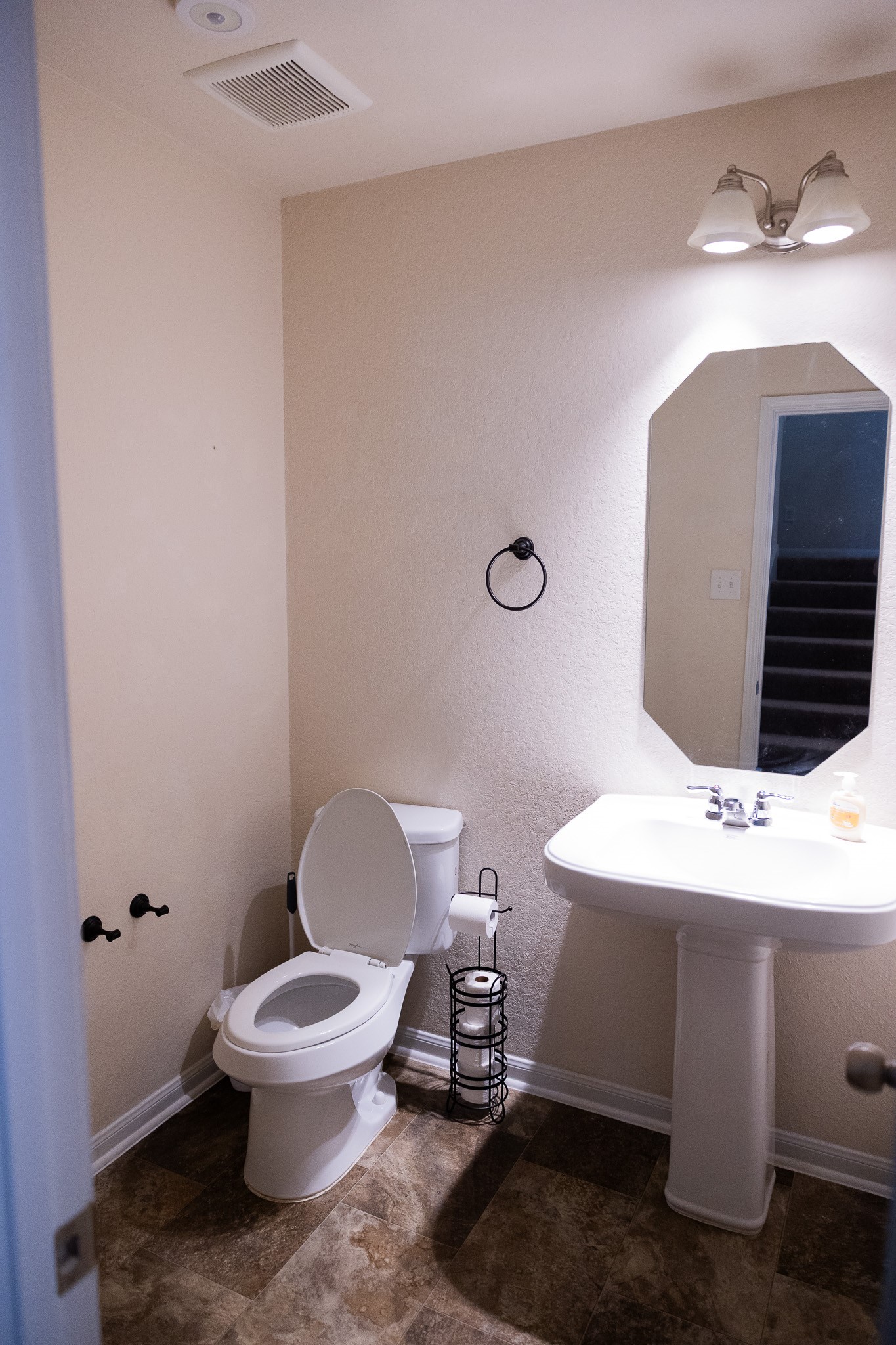 14550 Myers Drive Houston, TX 77090 - Photo 14 of 23 a bathroom with a toilet a sink and mirror