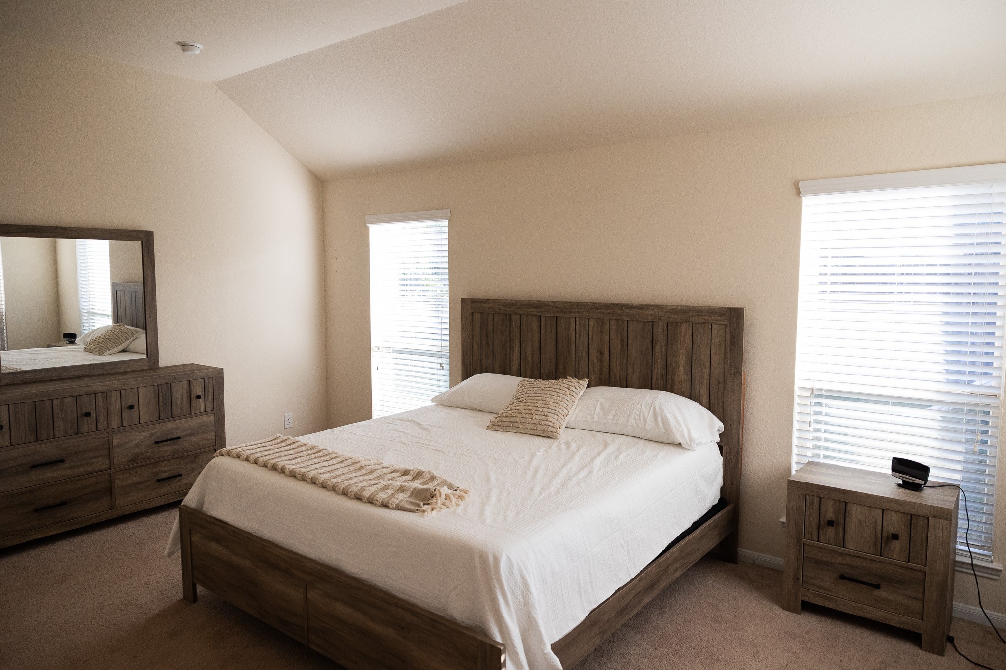 14550 Myers Drive Houston, TX 77090 - Photo 15 of 23 a bedroom with a bed and a dresser