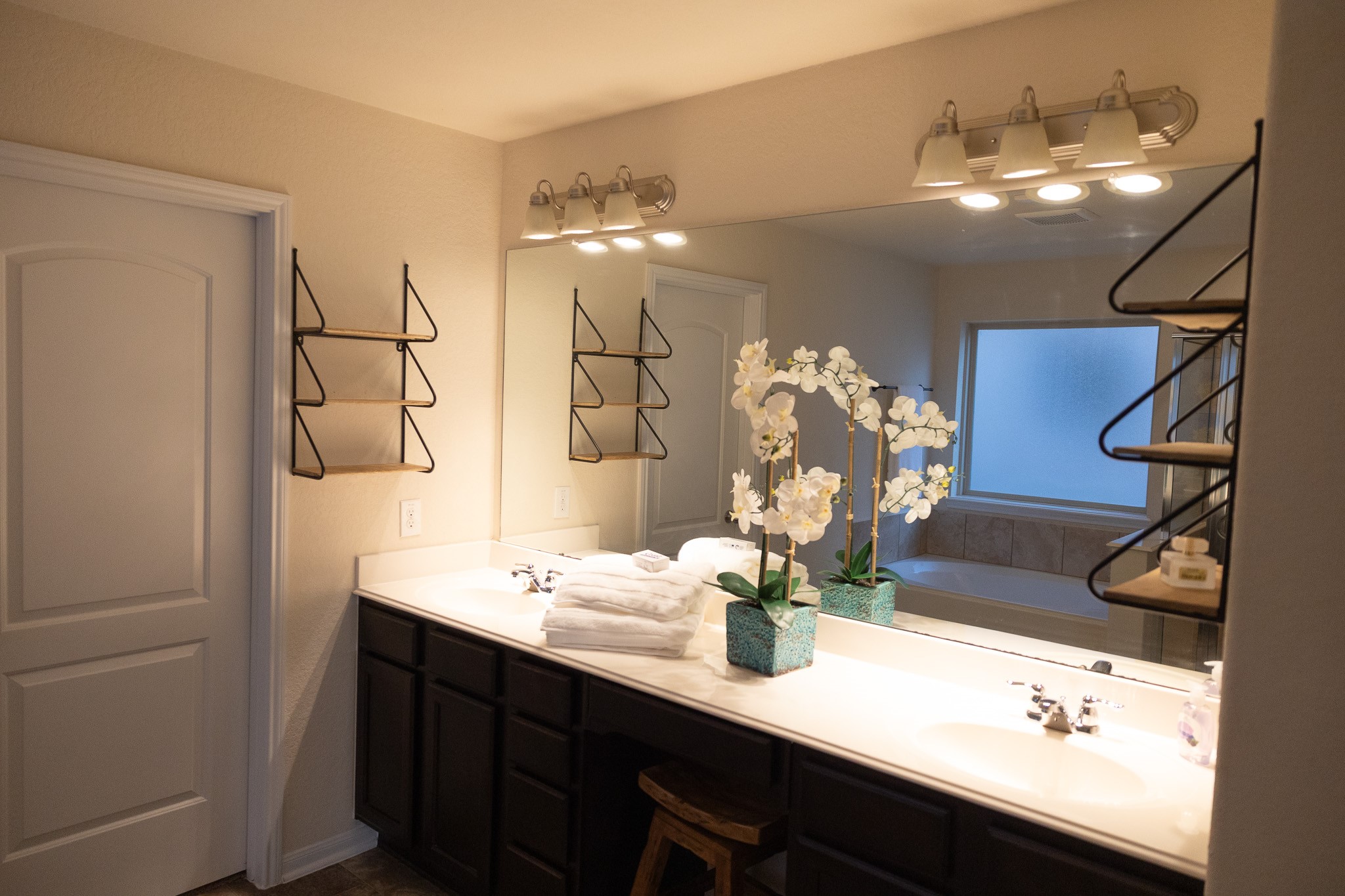 14550 Myers Drive Houston, TX 77090 - Photo 18 of 23 a bathroom with a sink a vanity and mirror