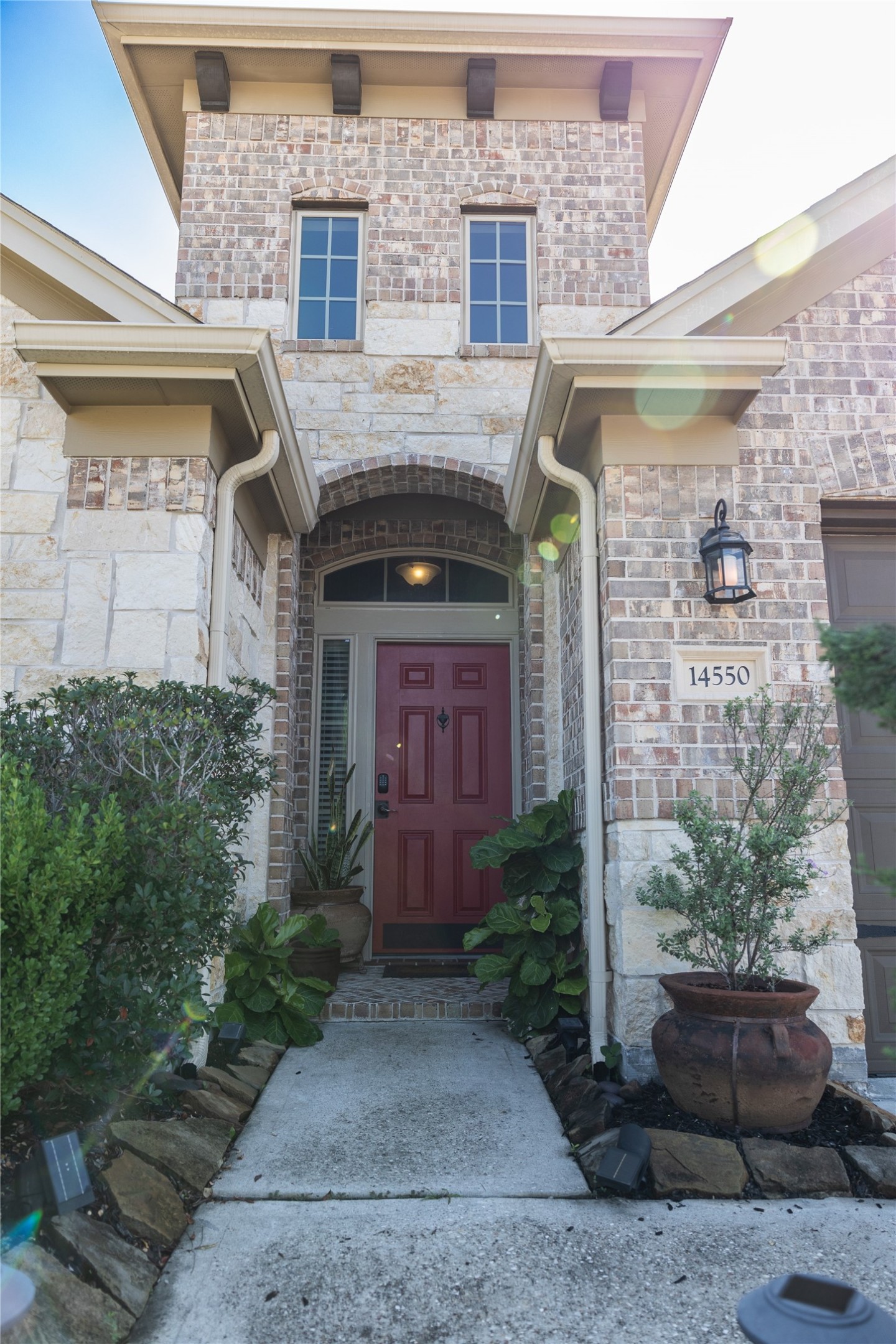 14550 Myers Drive Houston, TX 77090 - Photo 2 of 23 a front view of a house with garden