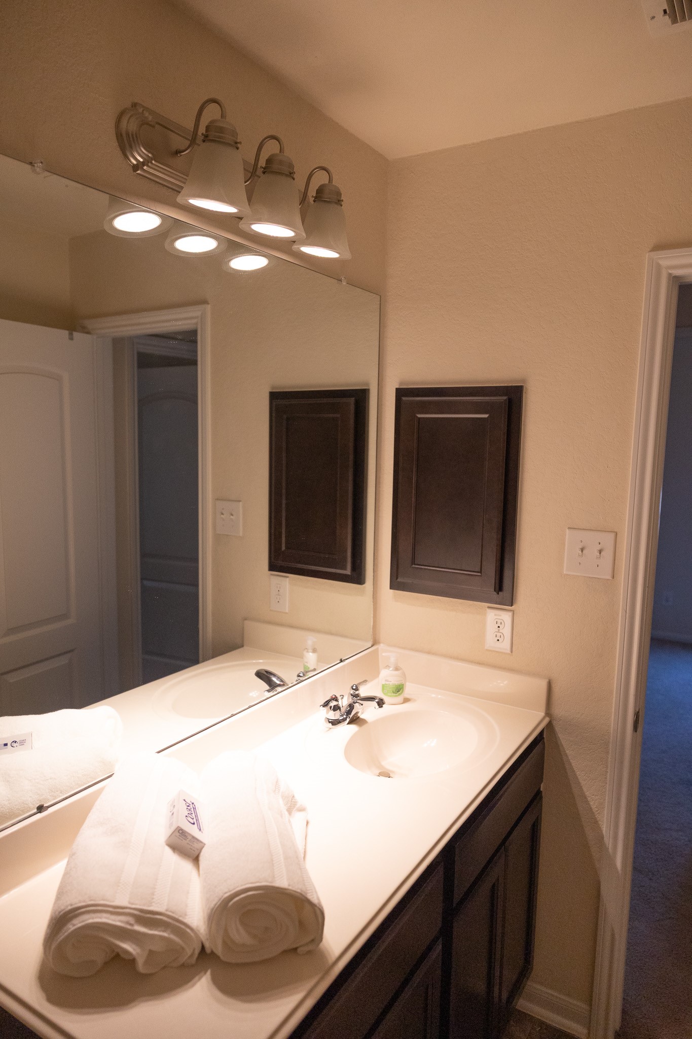 14550 Myers Drive Houston, TX 77090 - Photo 10 of 23 a bathroom with a sink a large mirror and vanity