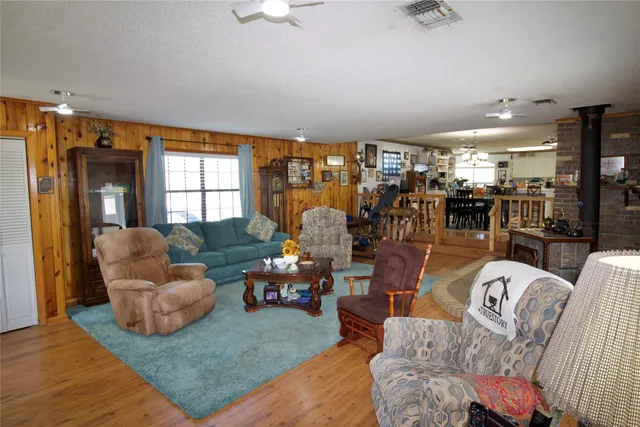 a brick building with granite countertop a sink and a stove