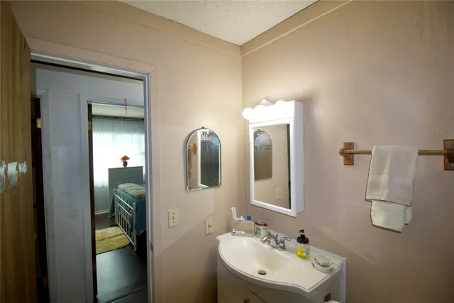 a backyard of a house with barbeque oven and outdoor seating