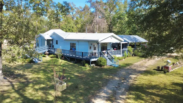 a view of a house with roof deck front of house