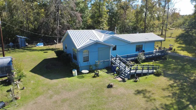 a living room with furniture chess board and a window